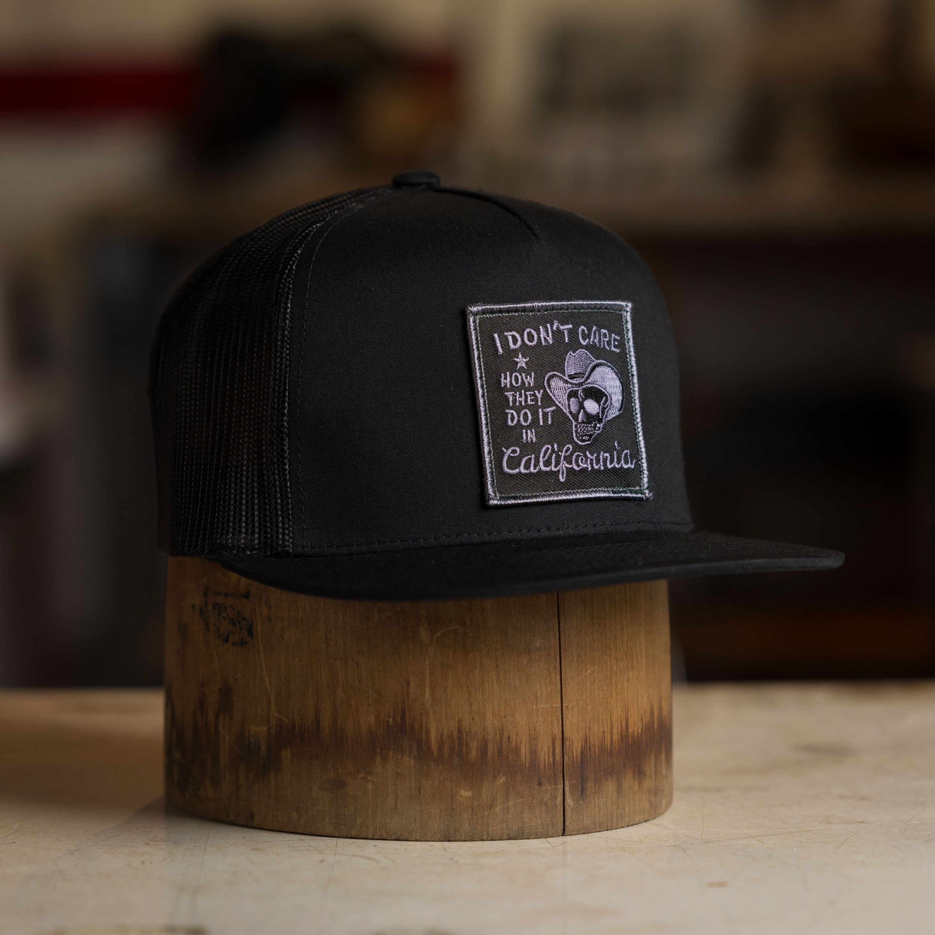I Don't Care How They Do It In California Trucker - Black on Black